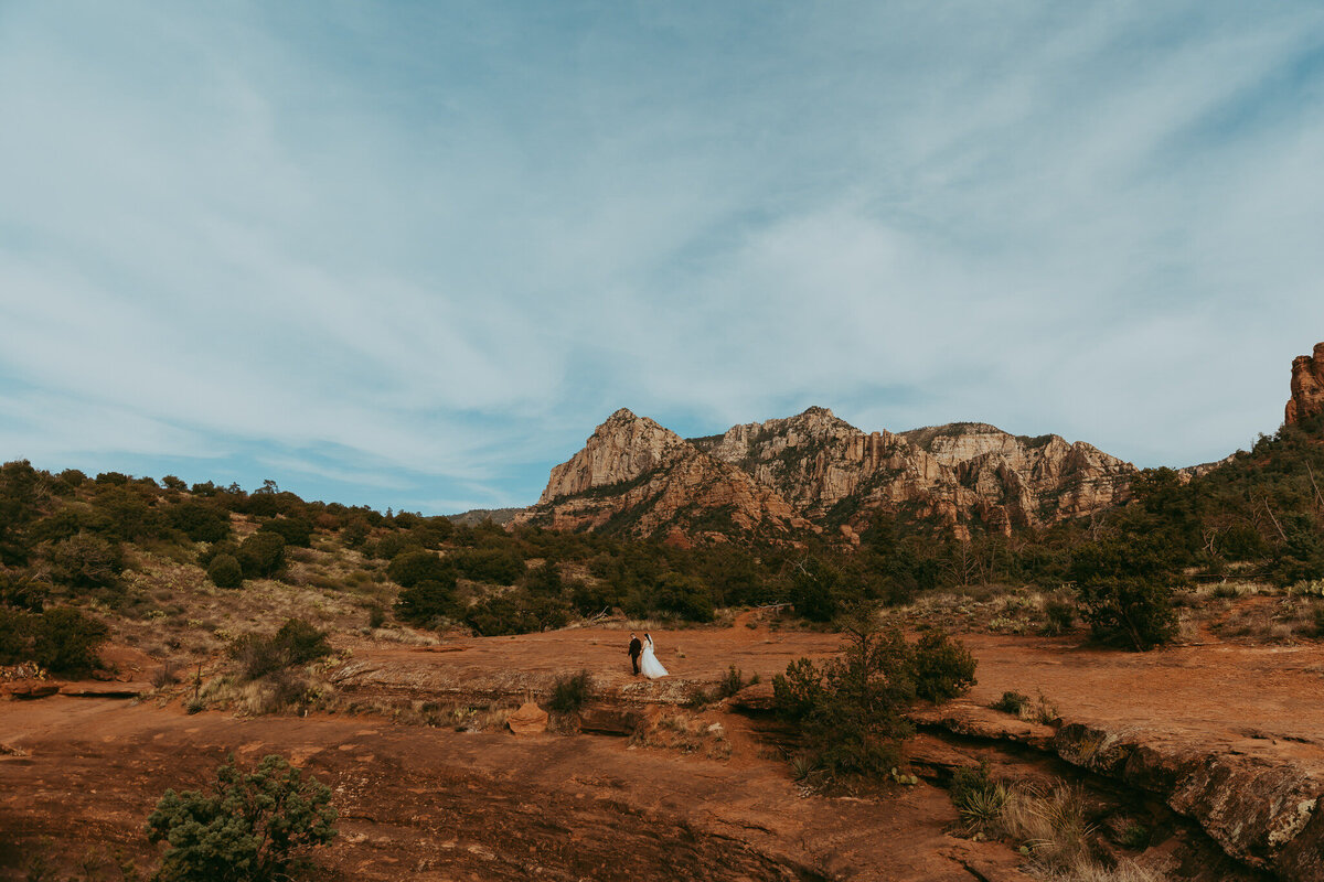 vast sedona landscape with bridal couple