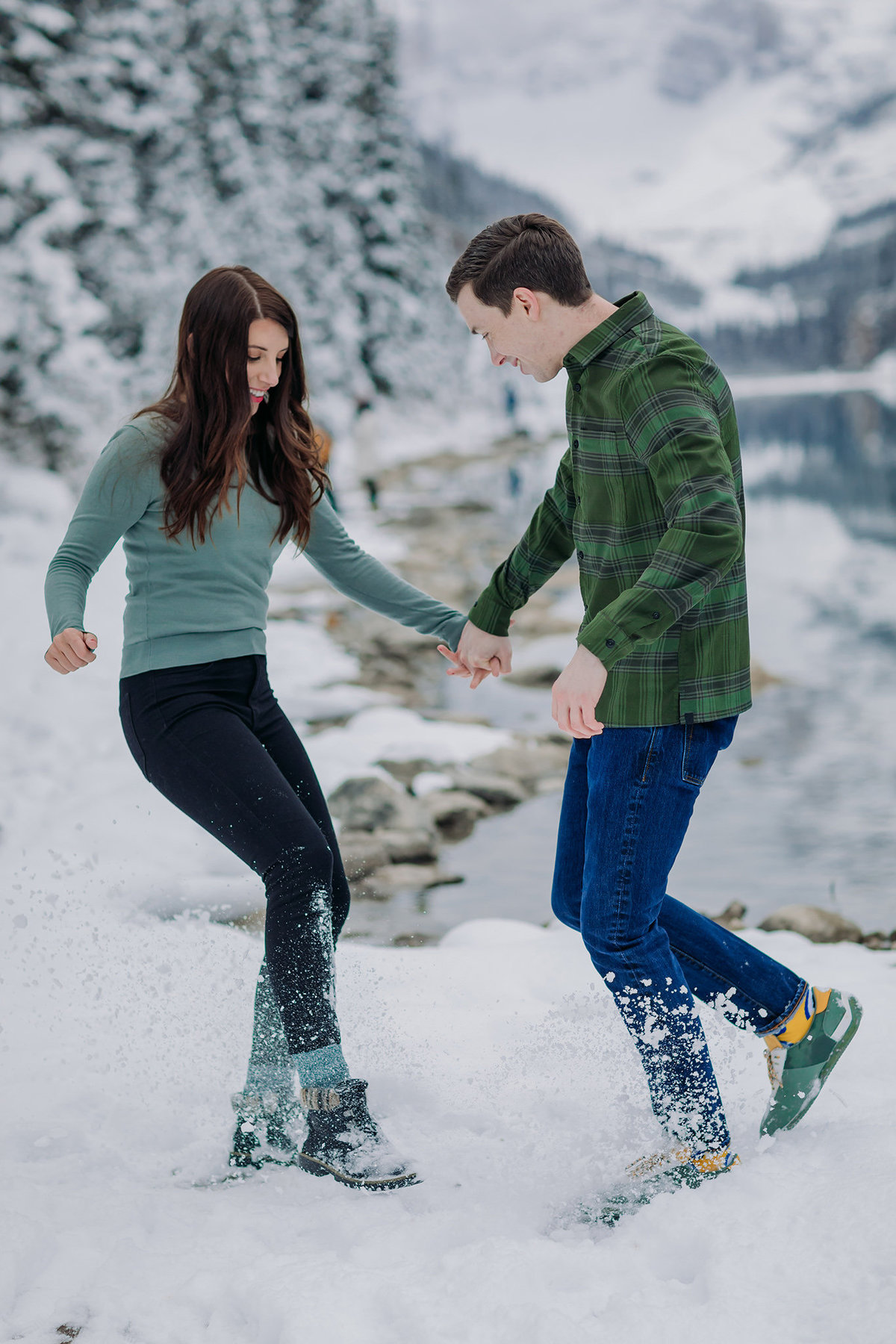 camping chic mountian casual playful winter engagement photos at lake louise