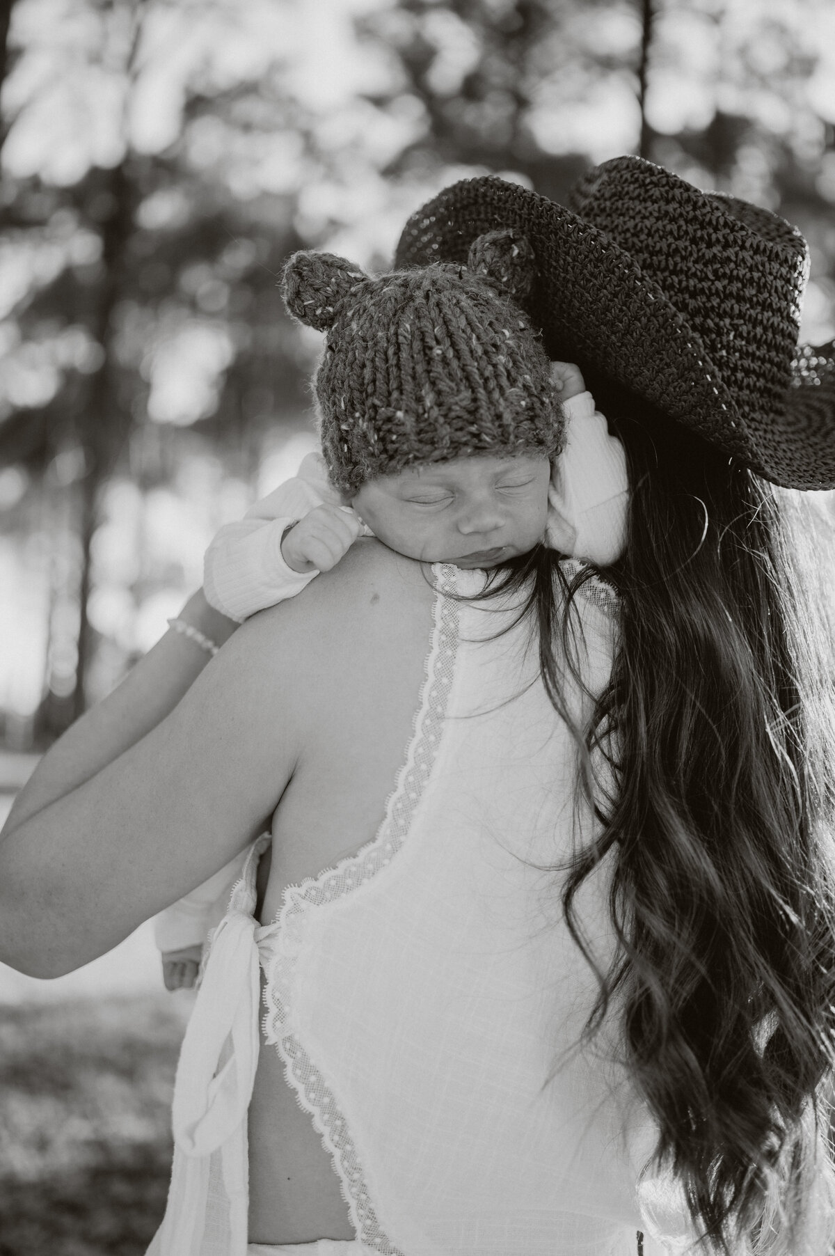 New parent snuggling baby during photo session
