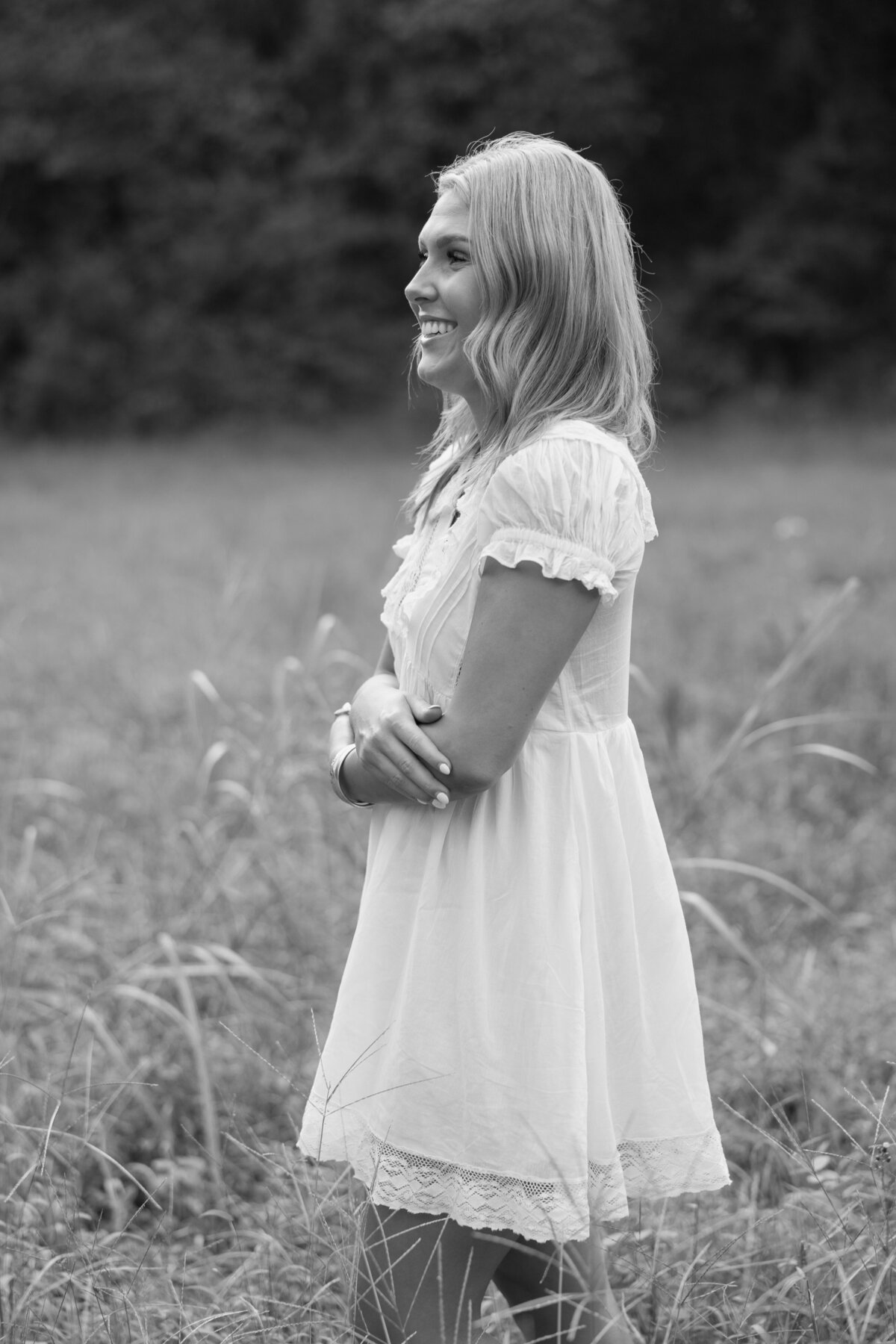 Senior photos in a field of tall grass