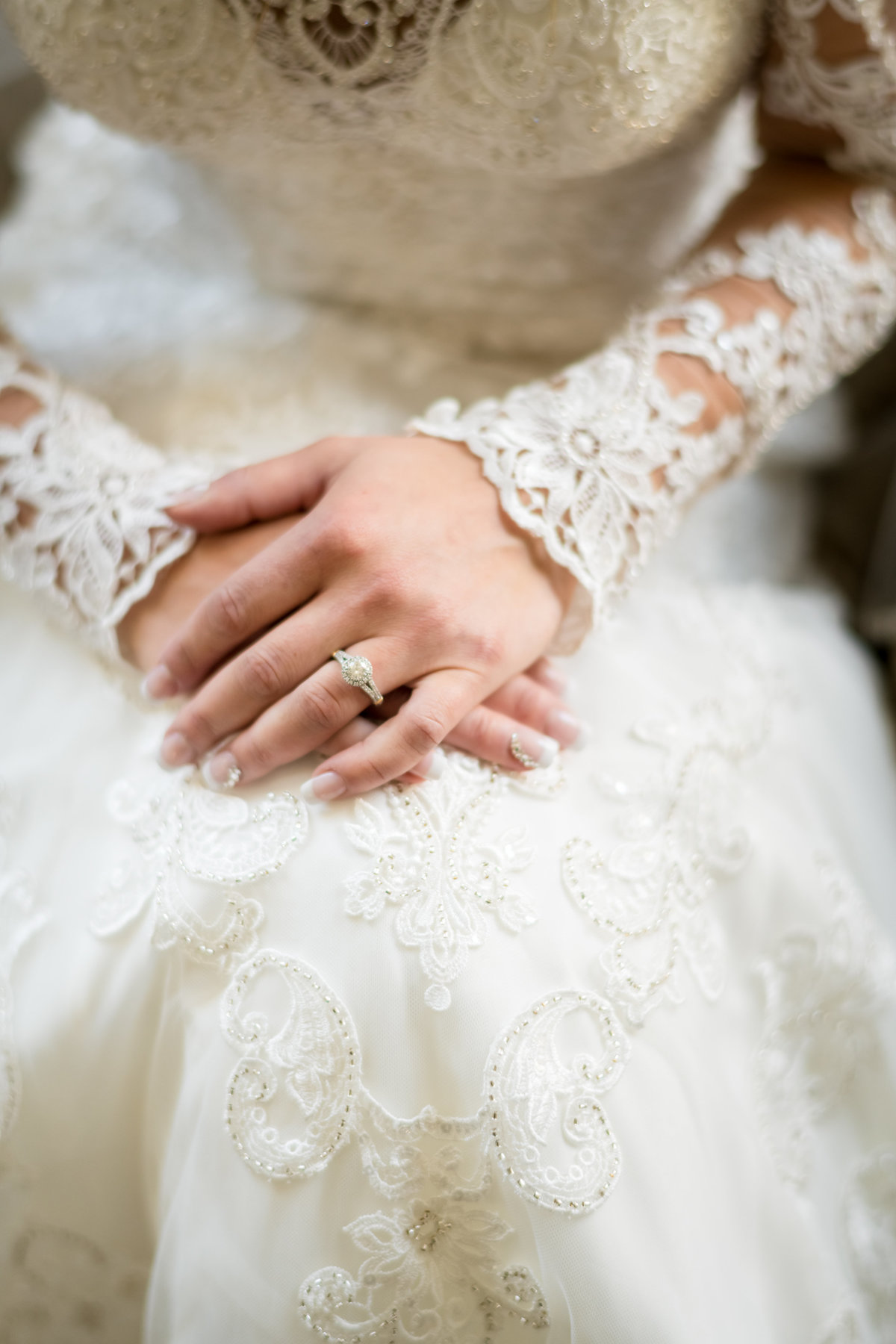 bride's hands and her wedding ring