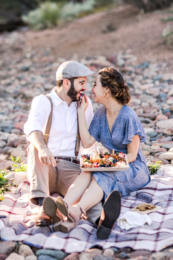engaged-couple-eating-charcuterie