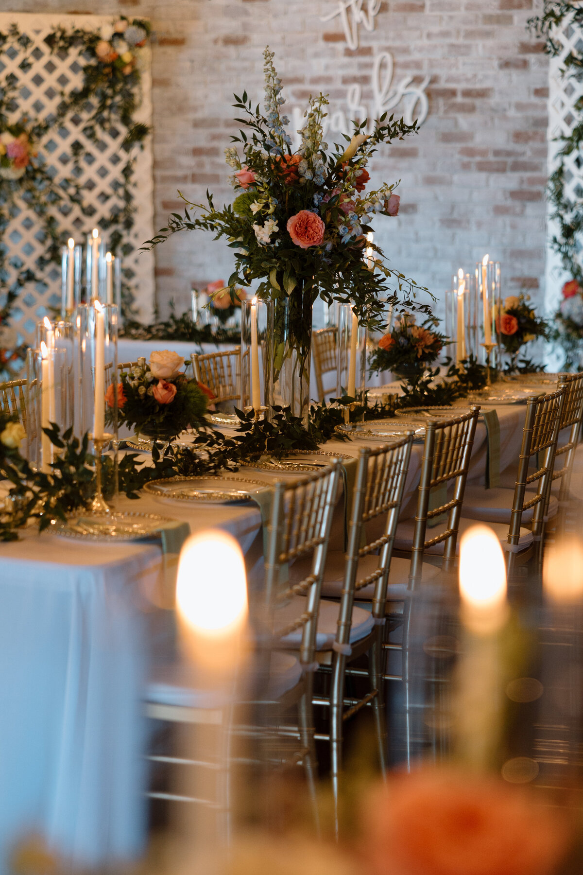 Banquet tables with taper candles and floral arrangements