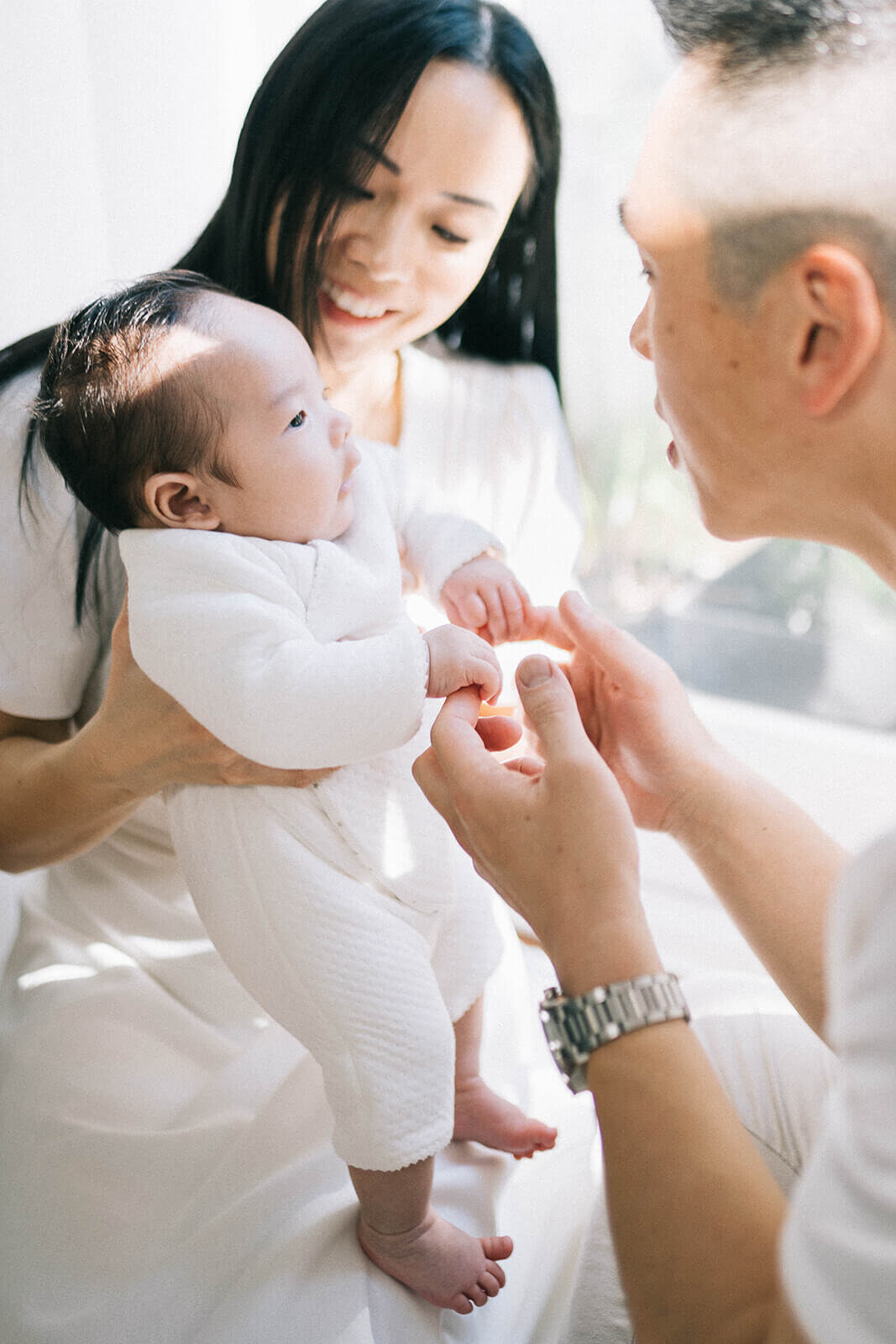 Inner-west-newborn-baby-photog-fathers-hands-holding-baby