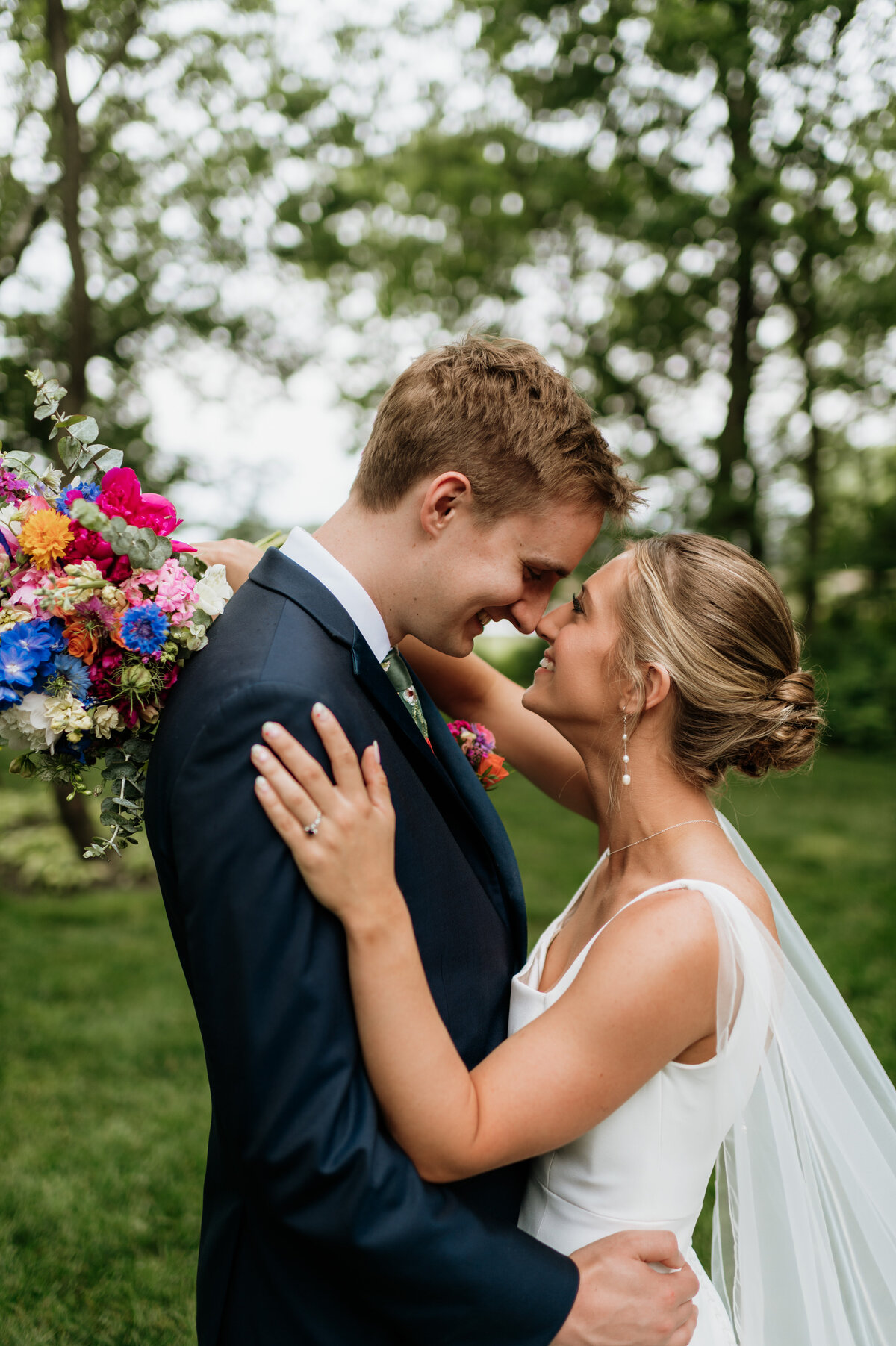 Emotional bride and groom first look outdoors