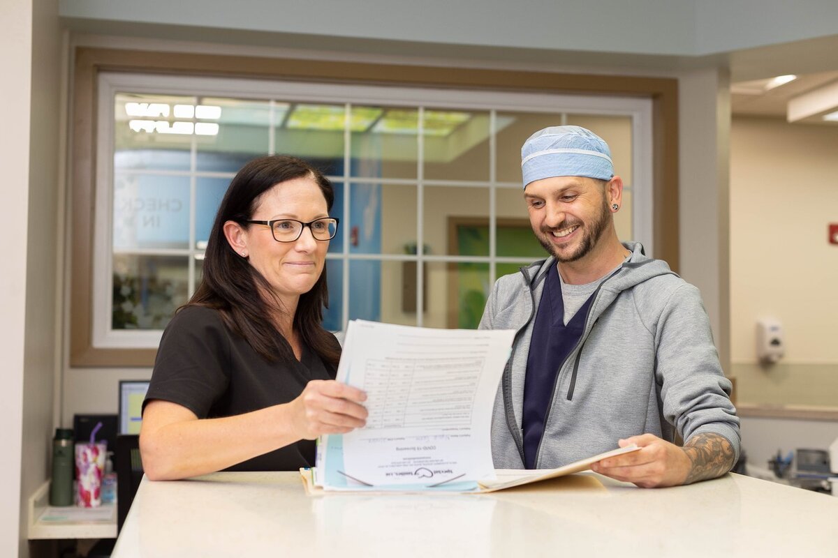 Two doctors consulting a chart together