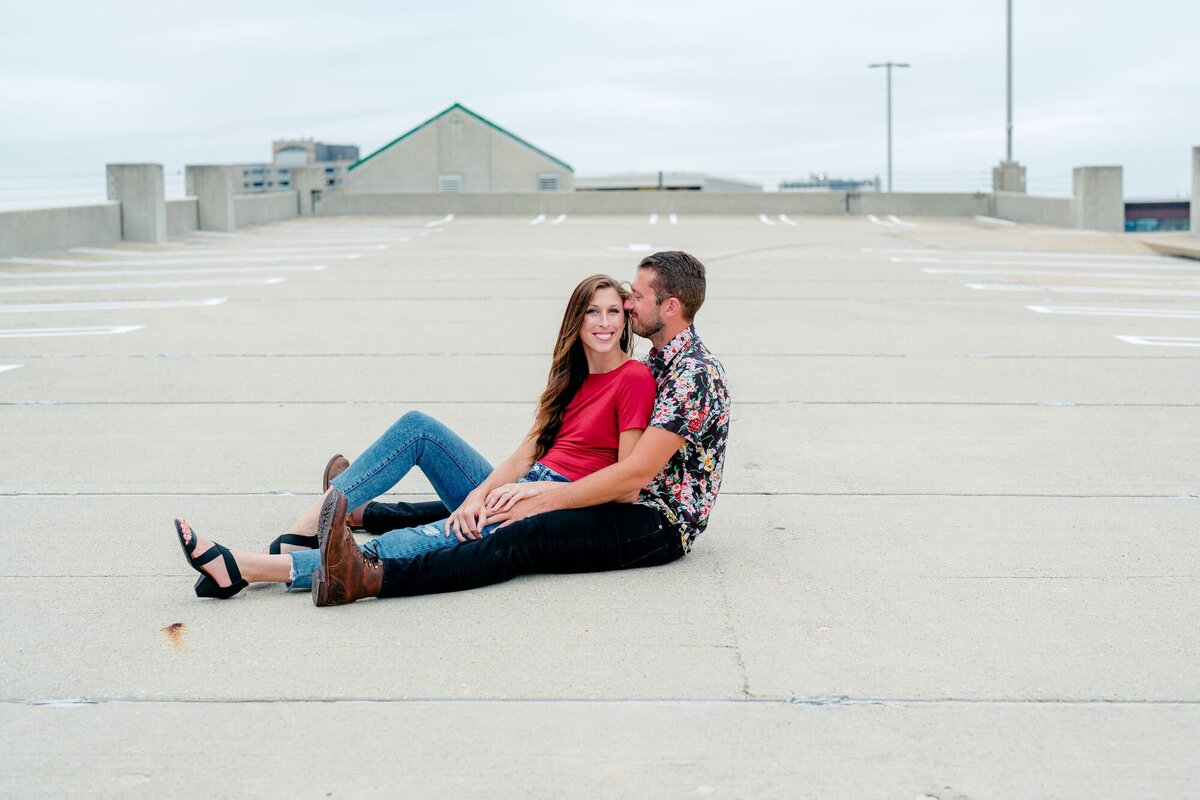 couple-sitting-close-embrace-urban-engagement