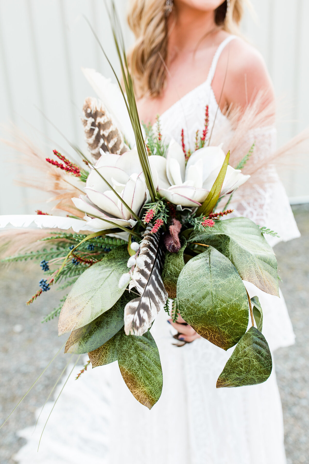 Bride holding her winter wedding flowers