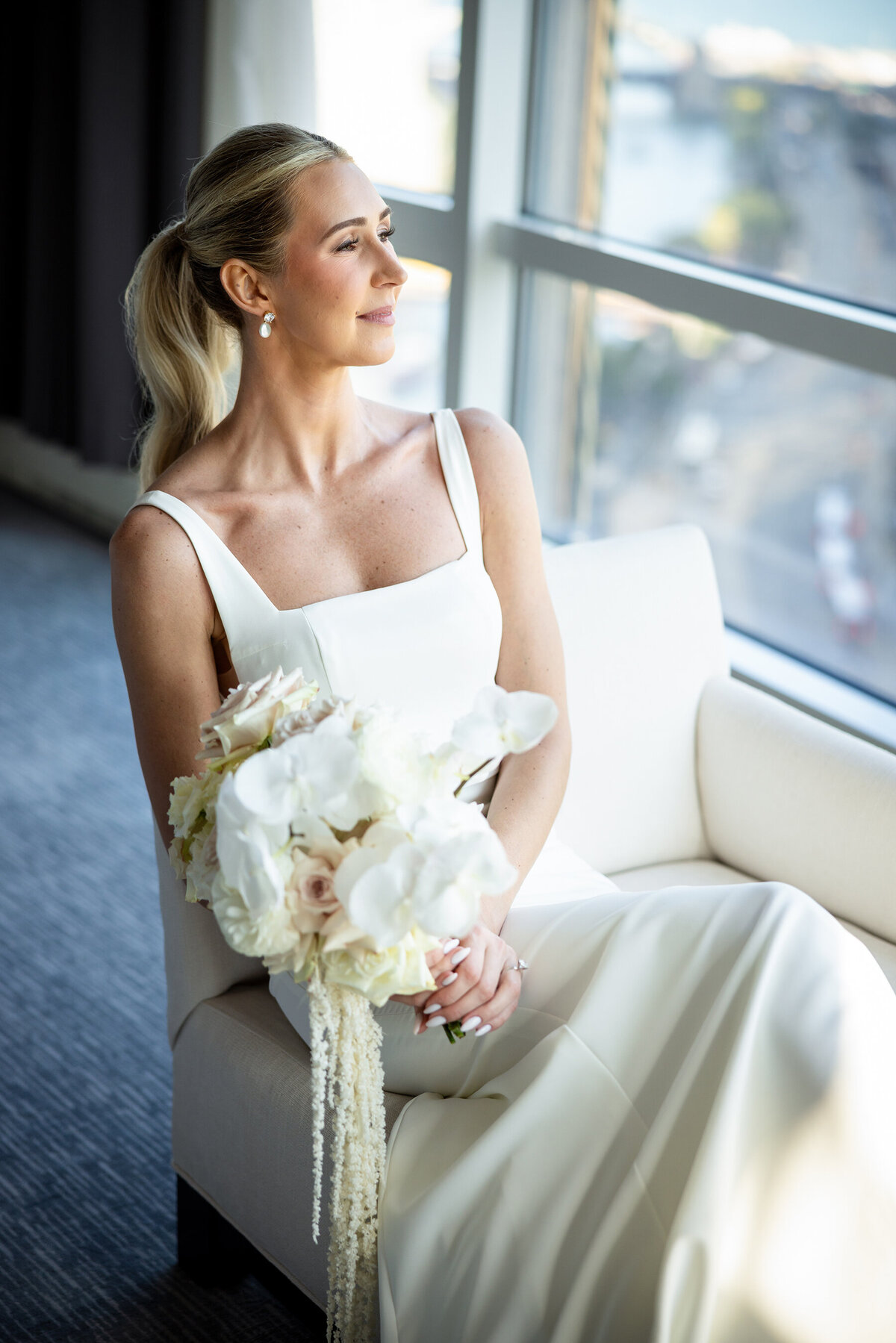 Elegant bride looking out the window