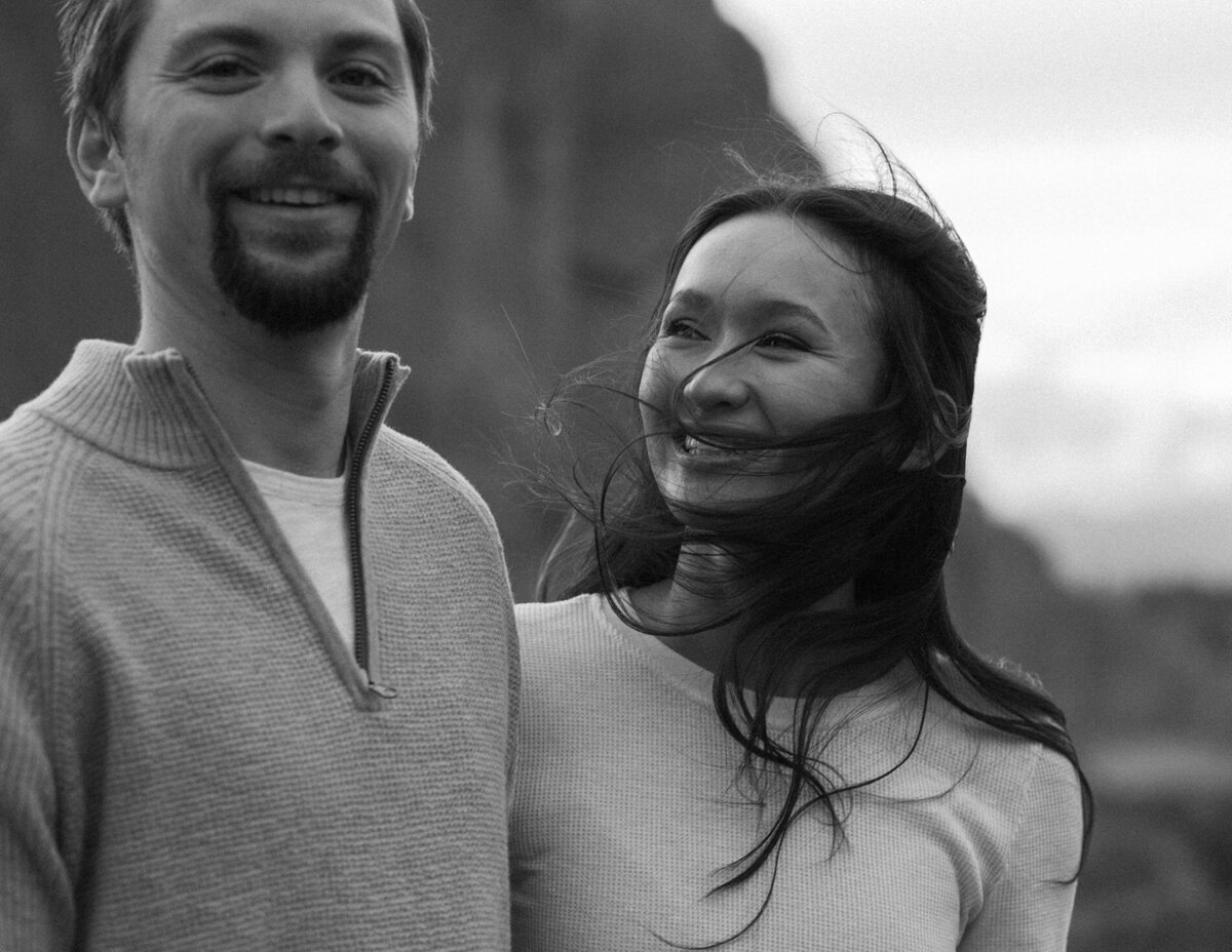 candid moment of girlfriend looking at boyfriend during an engagement session in Bend, Oregon