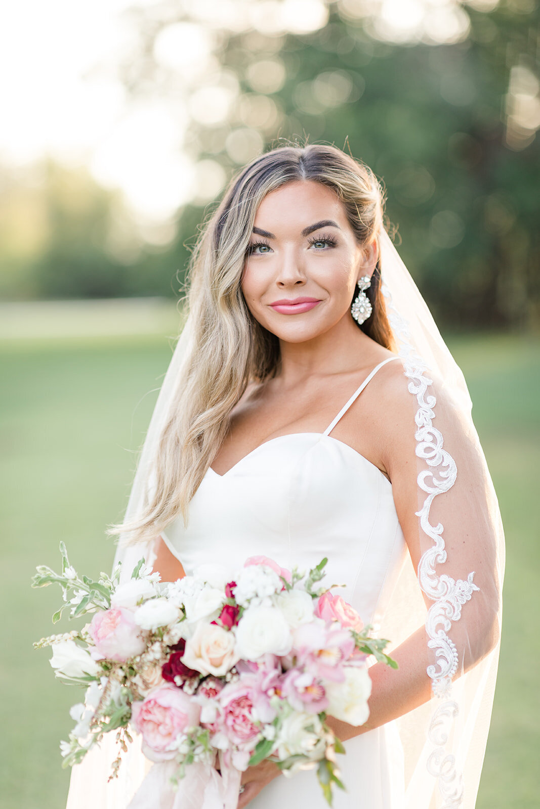 Bride with bouquet at Venue de LaChute; Shreveport, Louisiana