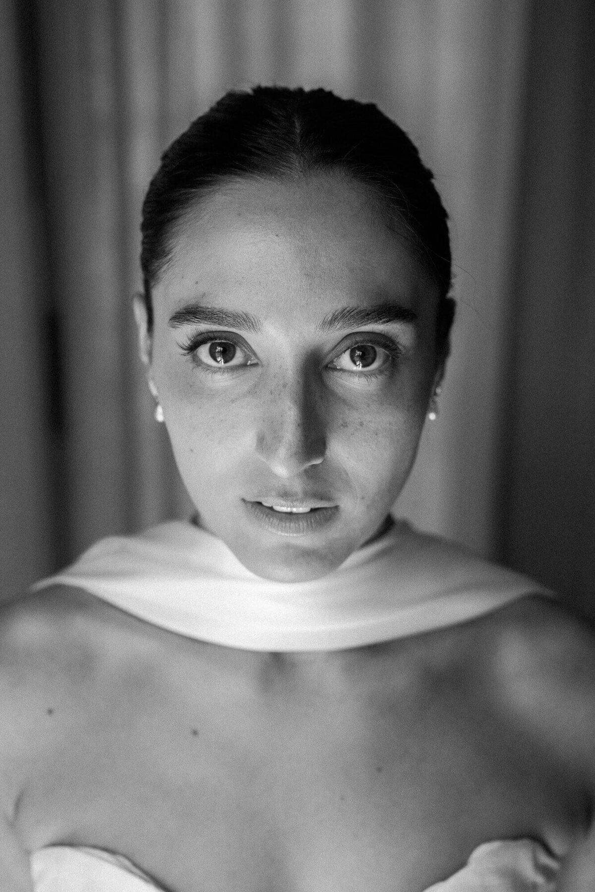 Close-up black and white bridal portrait highlighting natural beauty and emotion, photographed by a wedding photographer in Phoenix.