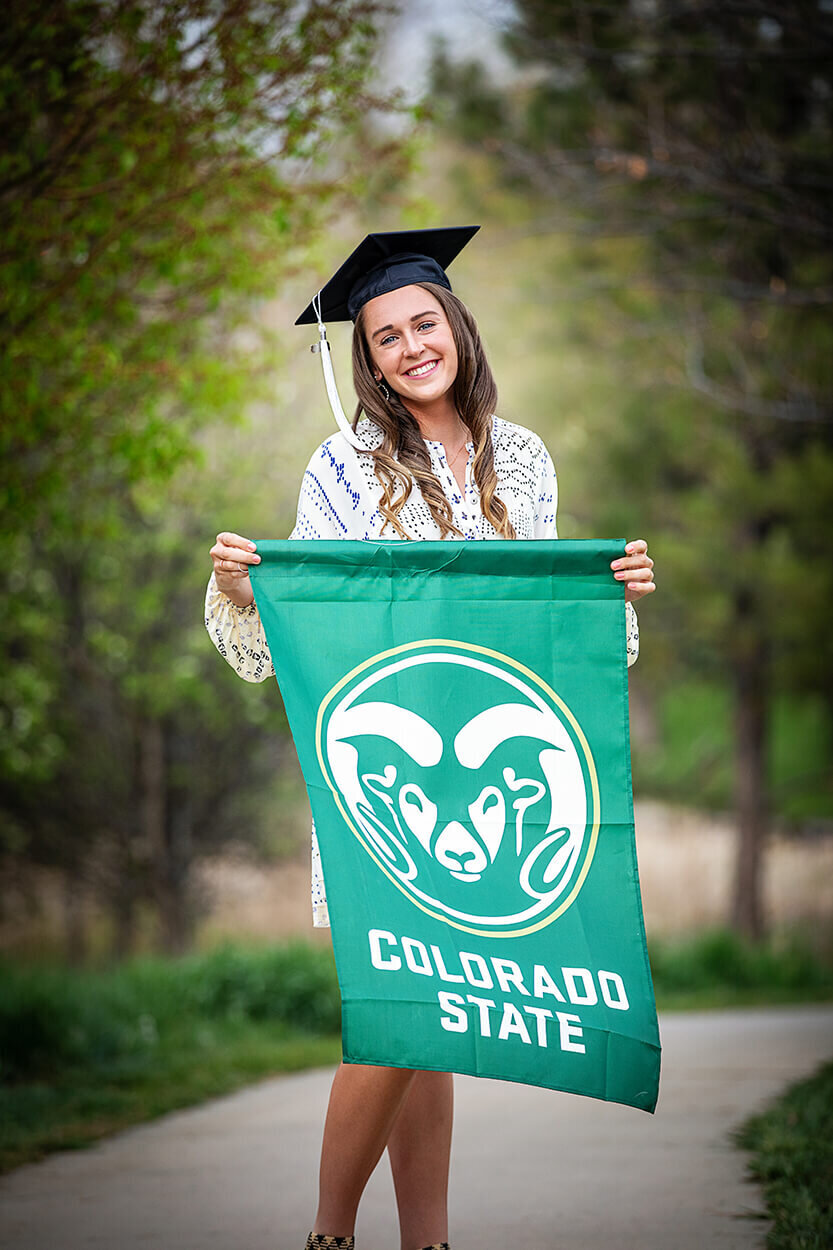 young-woman-holding-college-banner-professional-headshot