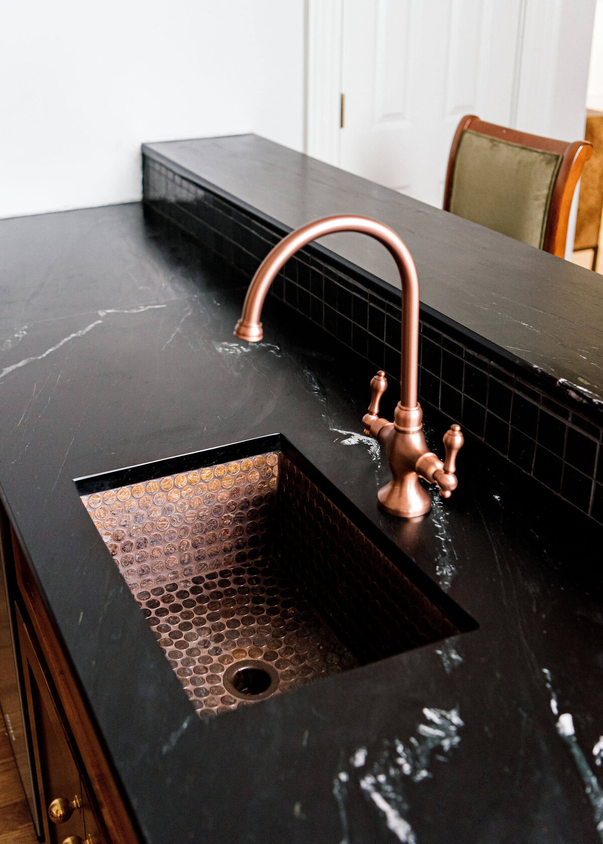 sweet southern home windmill brass sink with black marble counters