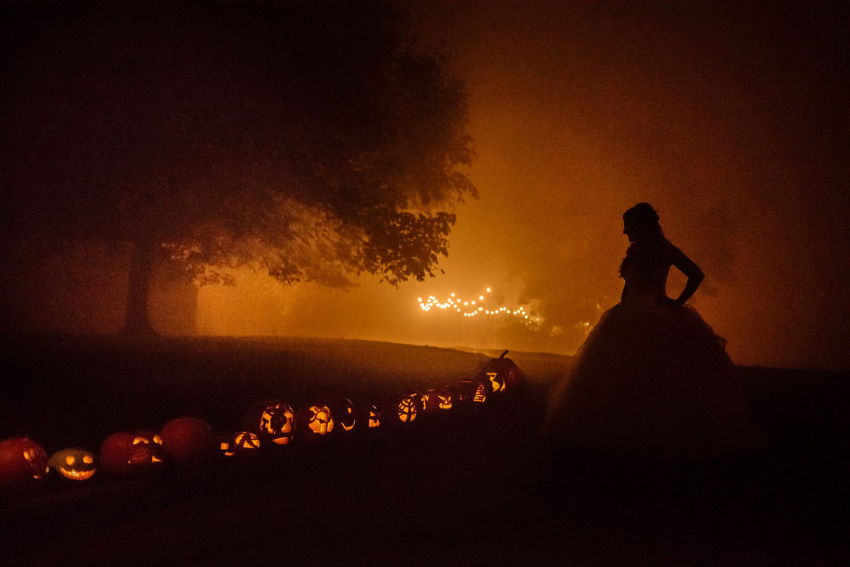 Bride with Halloween lanterns. East Riddlesden Hall wedding photographer