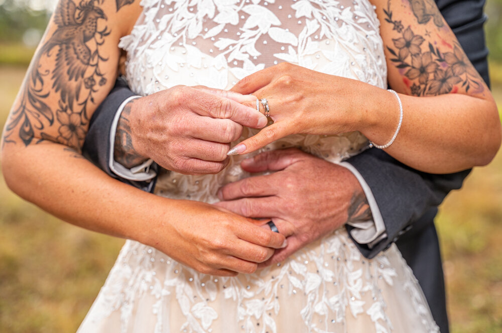 bride and groom exchanging rings - Townsville Wedding Photography by Jamie Simmons