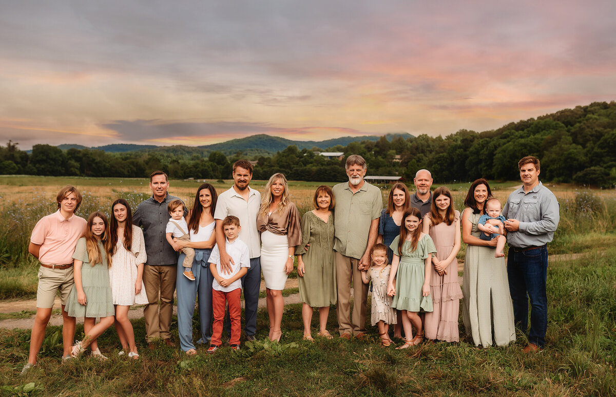 Large, extended family poses for portraits during Family Photoshoot in Asheville, NC.