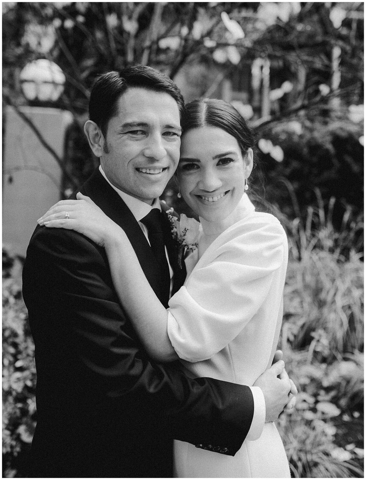 Bride and Groom embracing in the grounds of Hotel Saint Cecilia Austin