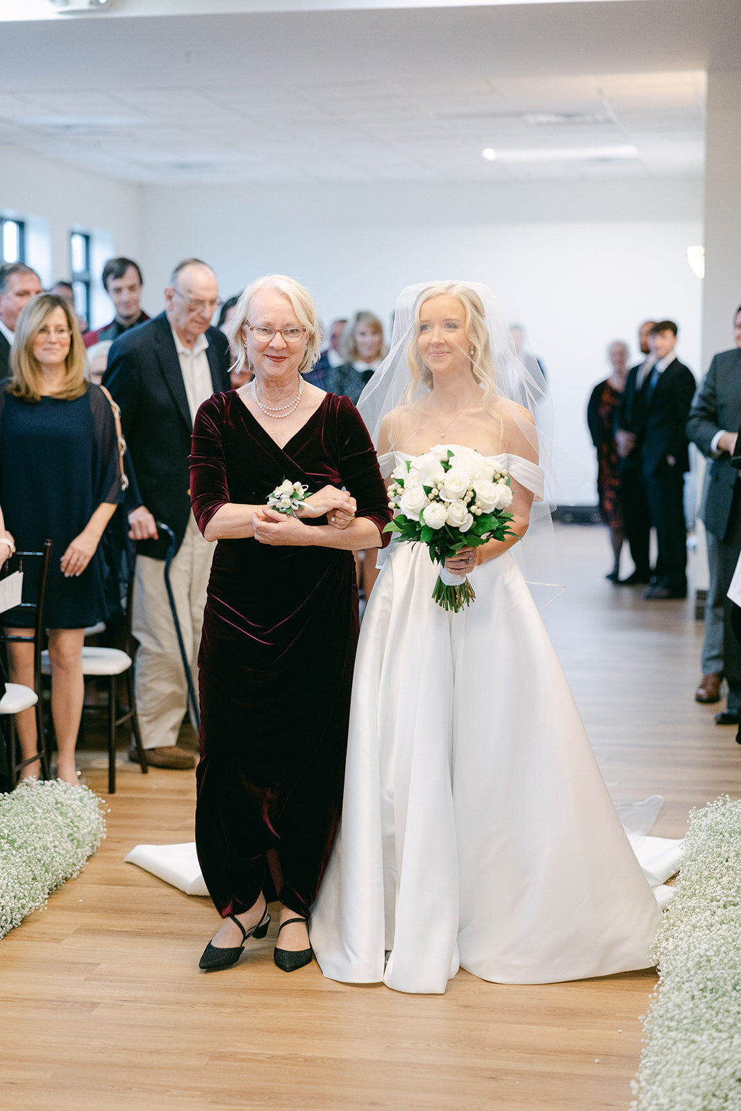 Bride and Mother of the Bride walking down the aisle shot by Philadelphia photographer.