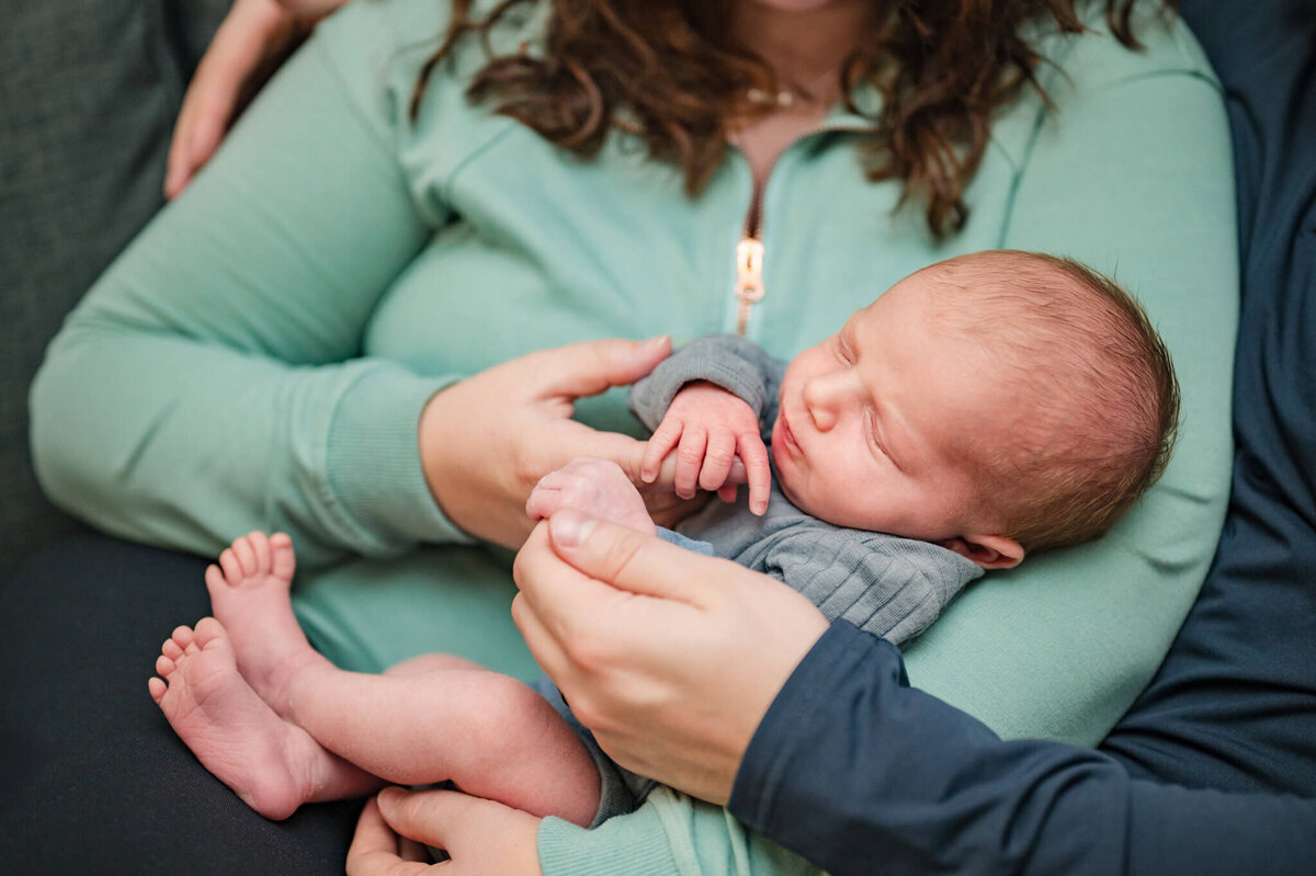 Parents holding newborn - up close shot
