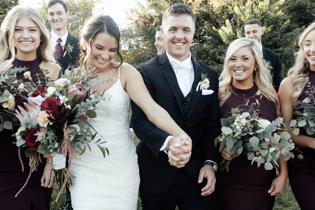 Bride and groom with wedding party. 