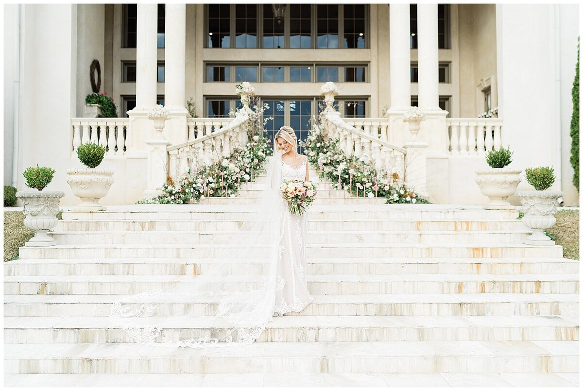 Bride standing on white steps