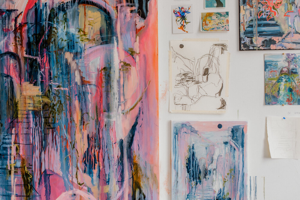 a wall filled with abstract art