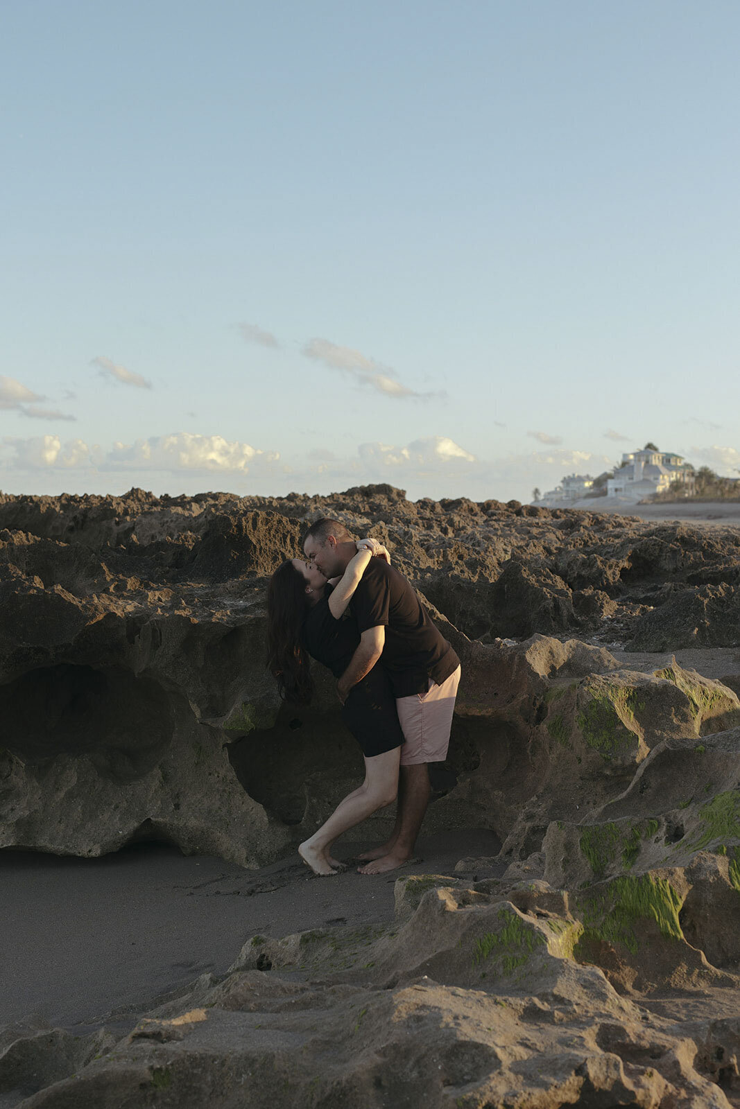Couple kissing on a sandy beach