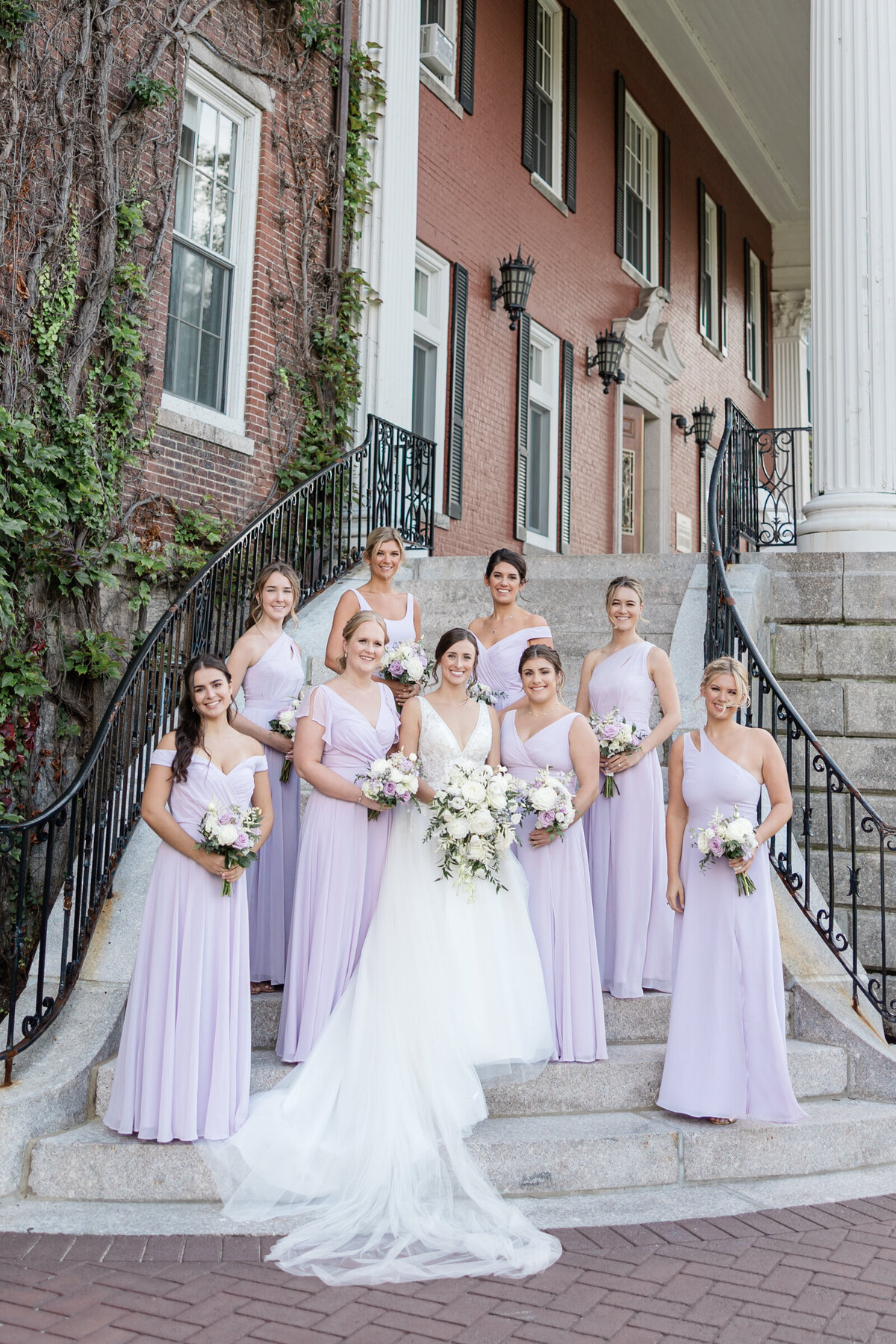 The bridal party in lavender bridesmaids dresses