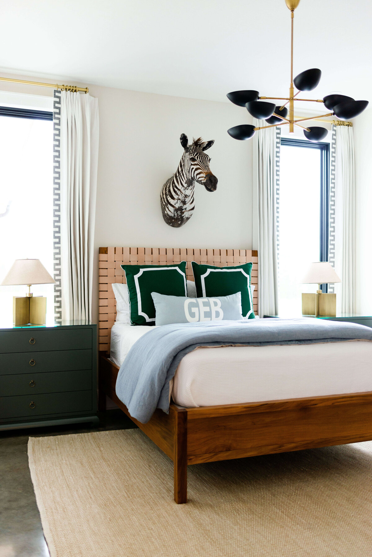 oyster creek studios building belt new build zebra head over wooden bed in bedroom