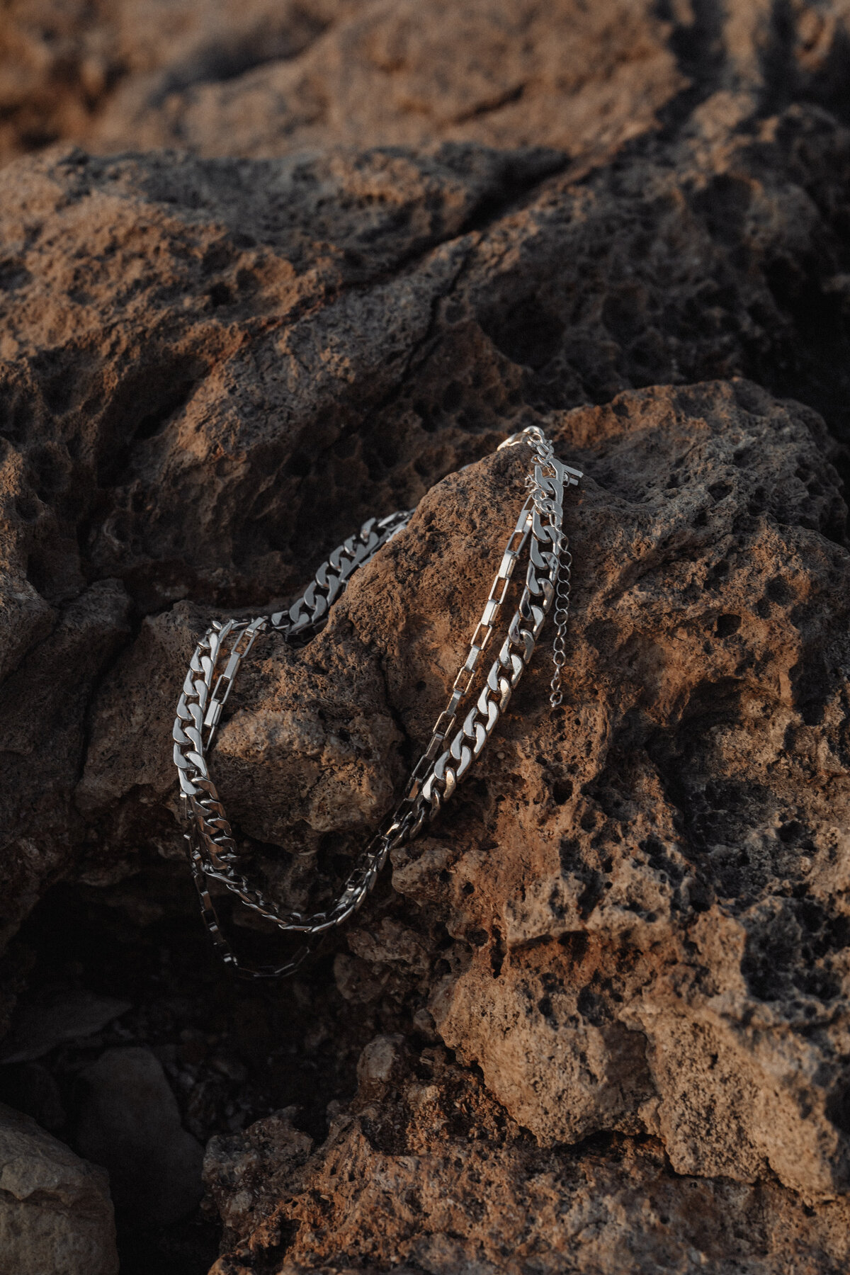 kaboompics_simplicity-by-the-sea-minimalist-jewelry-on-maltas-rocky-beach-31117