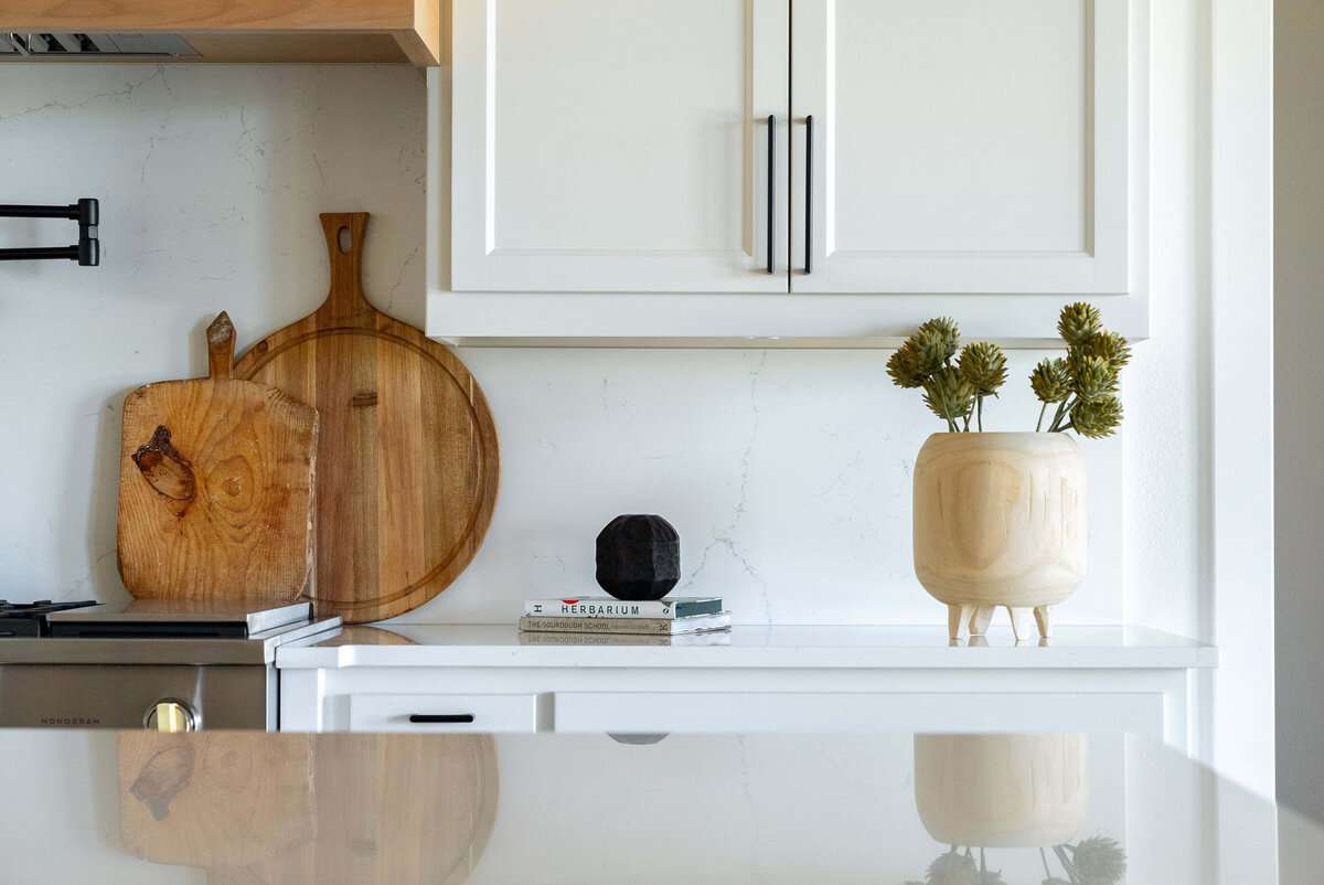 Custom home with elegant kitchen with wood accents