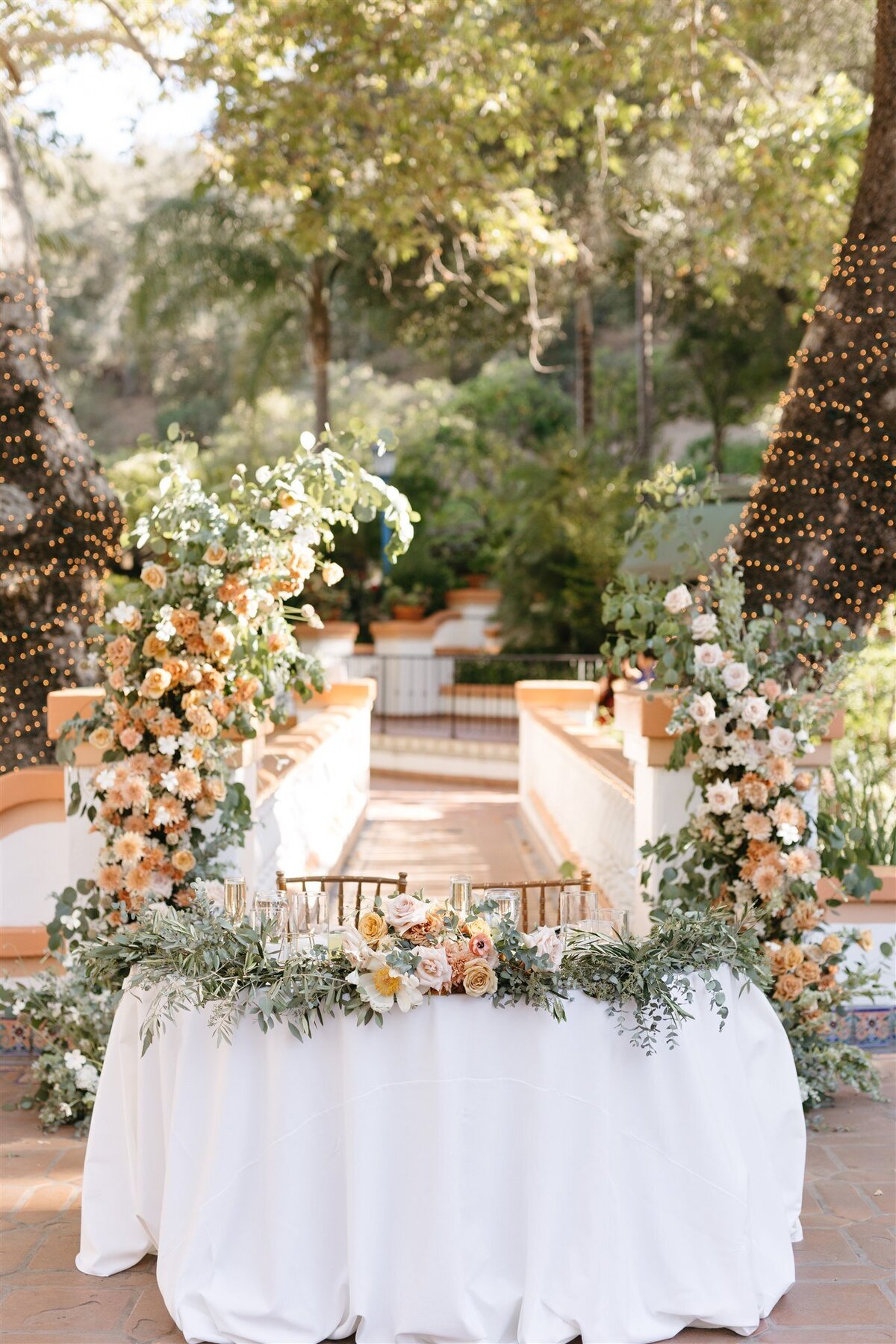 Rancho Las Lomas wedding reception Sweetheart Table florals and greenery