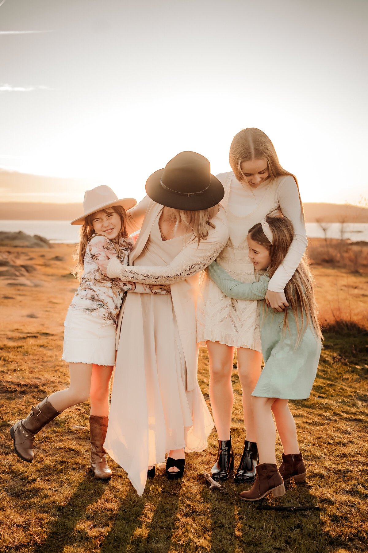 family girls snuggle sunrise