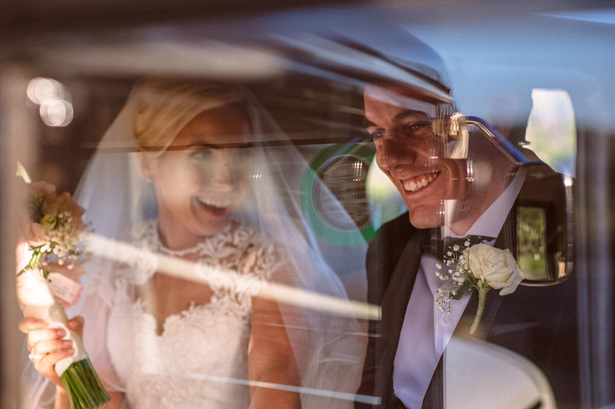 18 bride-and-groom-in-back-of-bridal-car