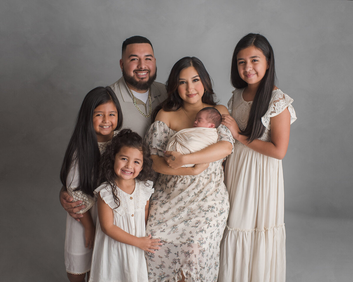 a big family of six with a grey background