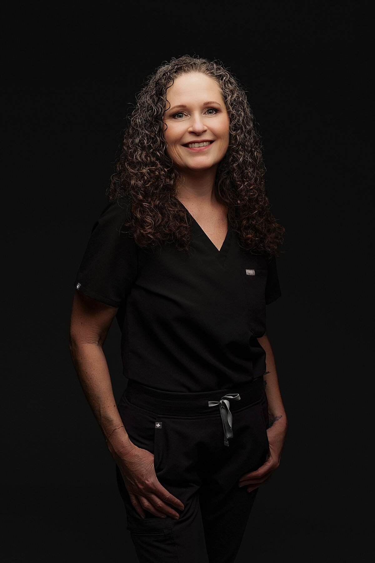 Stylish headshot of female entrepreneur with confident expression, photographed in Pflugerville studio