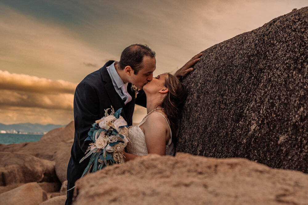 bride and groom sharing a kiss at sunset - Townsville Wedding Photography by Jamie Simmons
