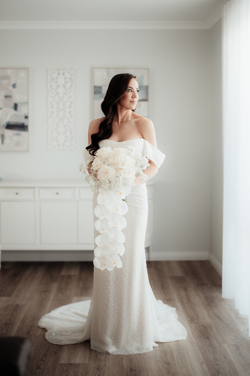 Bride standing in wedding dress