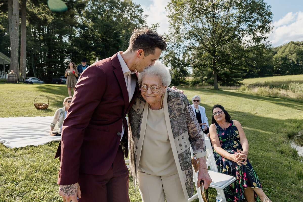 A person kissing their grandmother