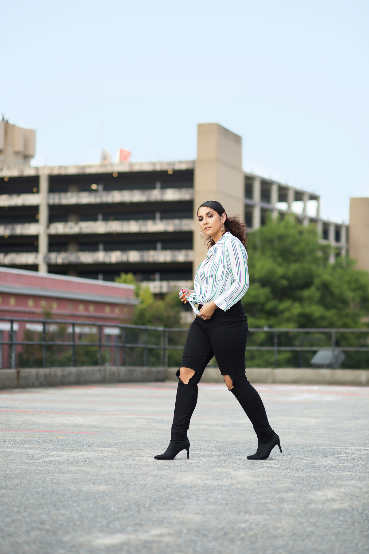 Senior girl walking on rooftop.