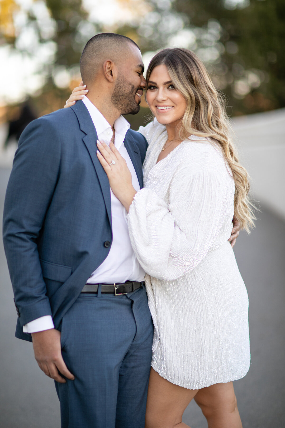 Groom kissing his bride-to-be