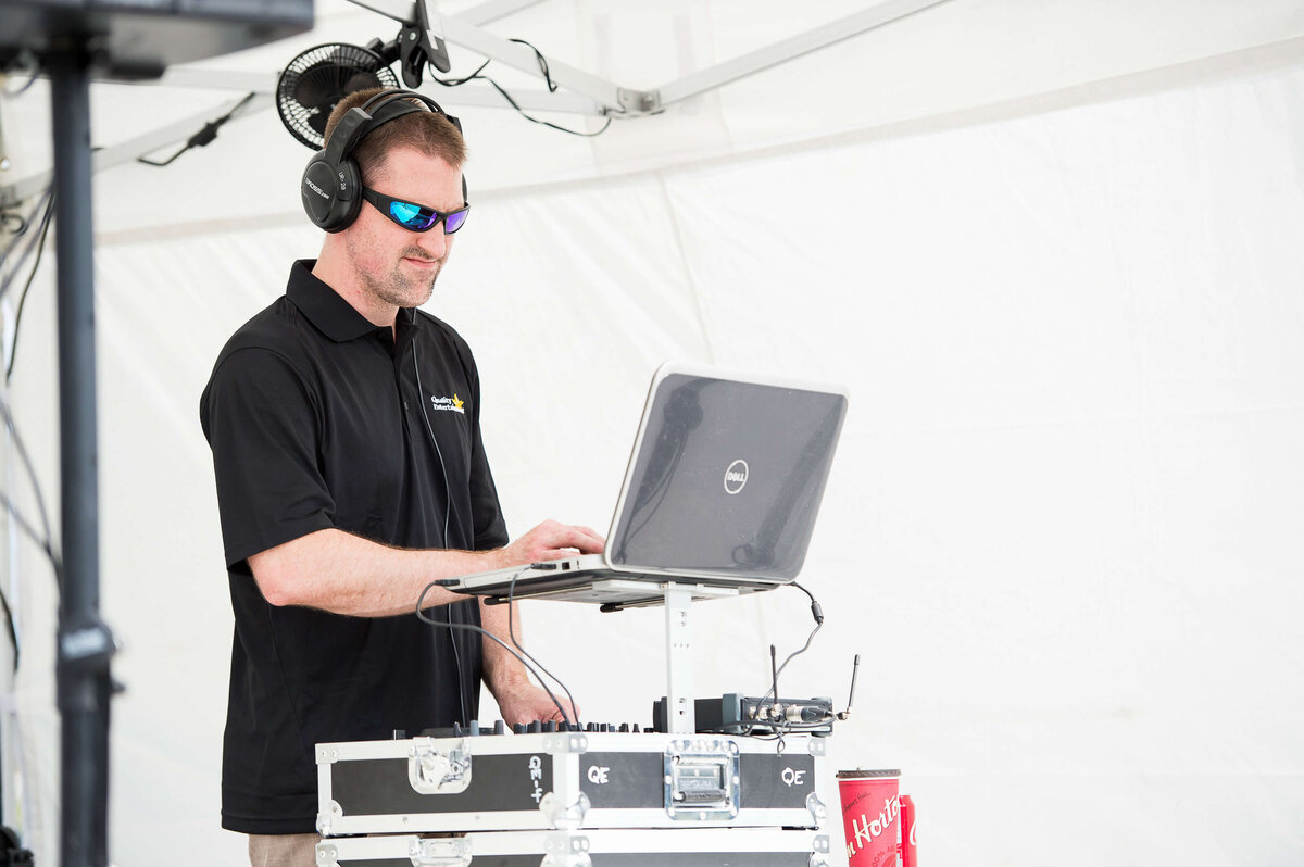 Ottawa event photos showing a DJ playing music during a corporate children's event.  Captured by JEMMAN Photography COMMERCIAL
