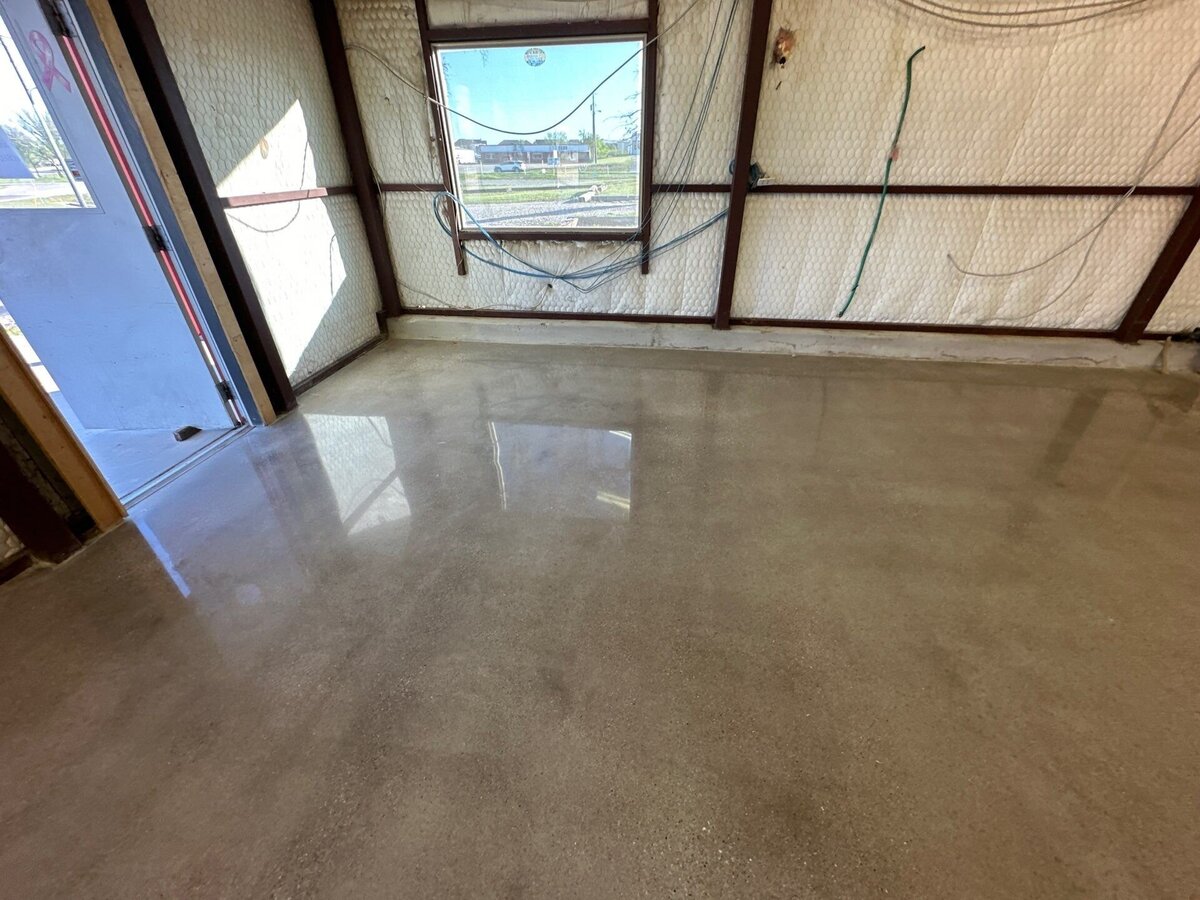 Residential Concrete Restoration in DFW featuring a team of professionals working to restore and polish concrete floors in a home, highlighting expert restoration services in the Dallas-Fort Worth area