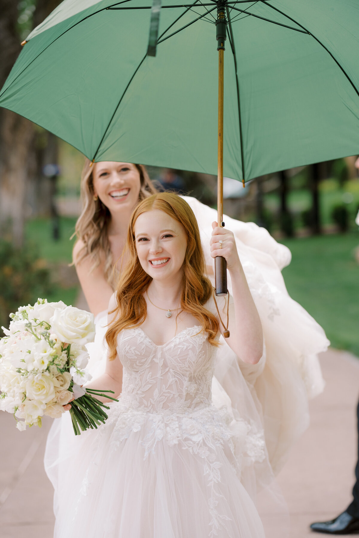 bride with umbrella at The Broadmoor Resort in Colorado Springs, Colorado
