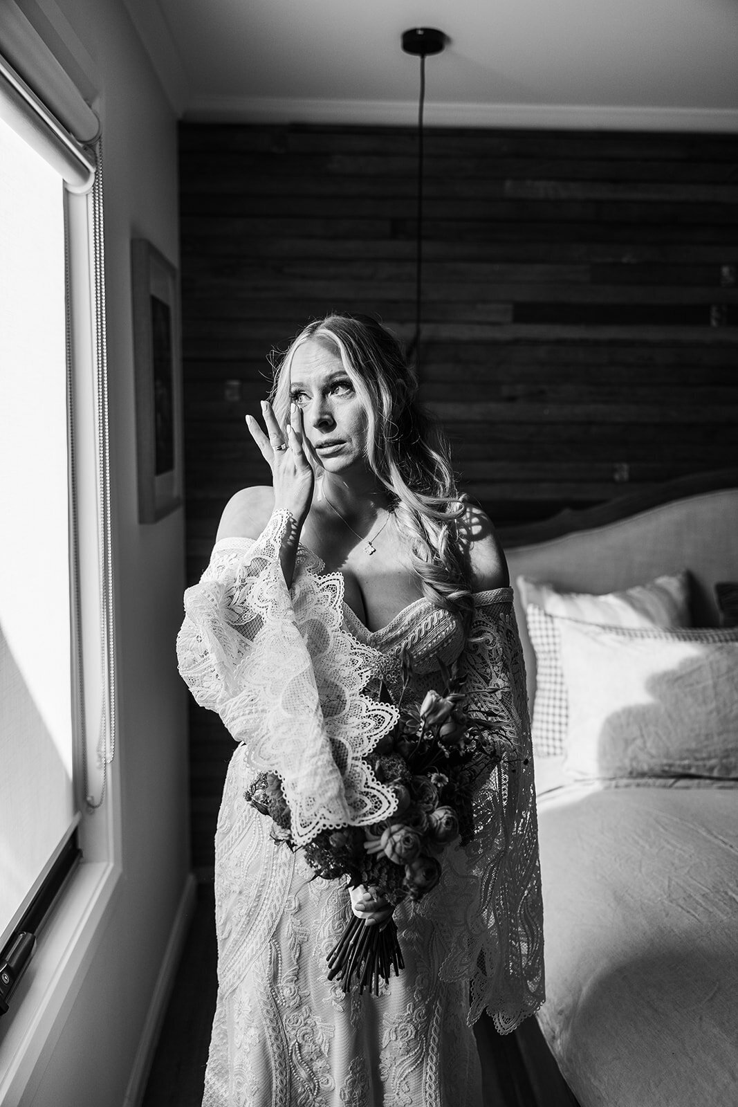 Bride sheds a tear as she gets ready for her wedding at Petrichor Farm