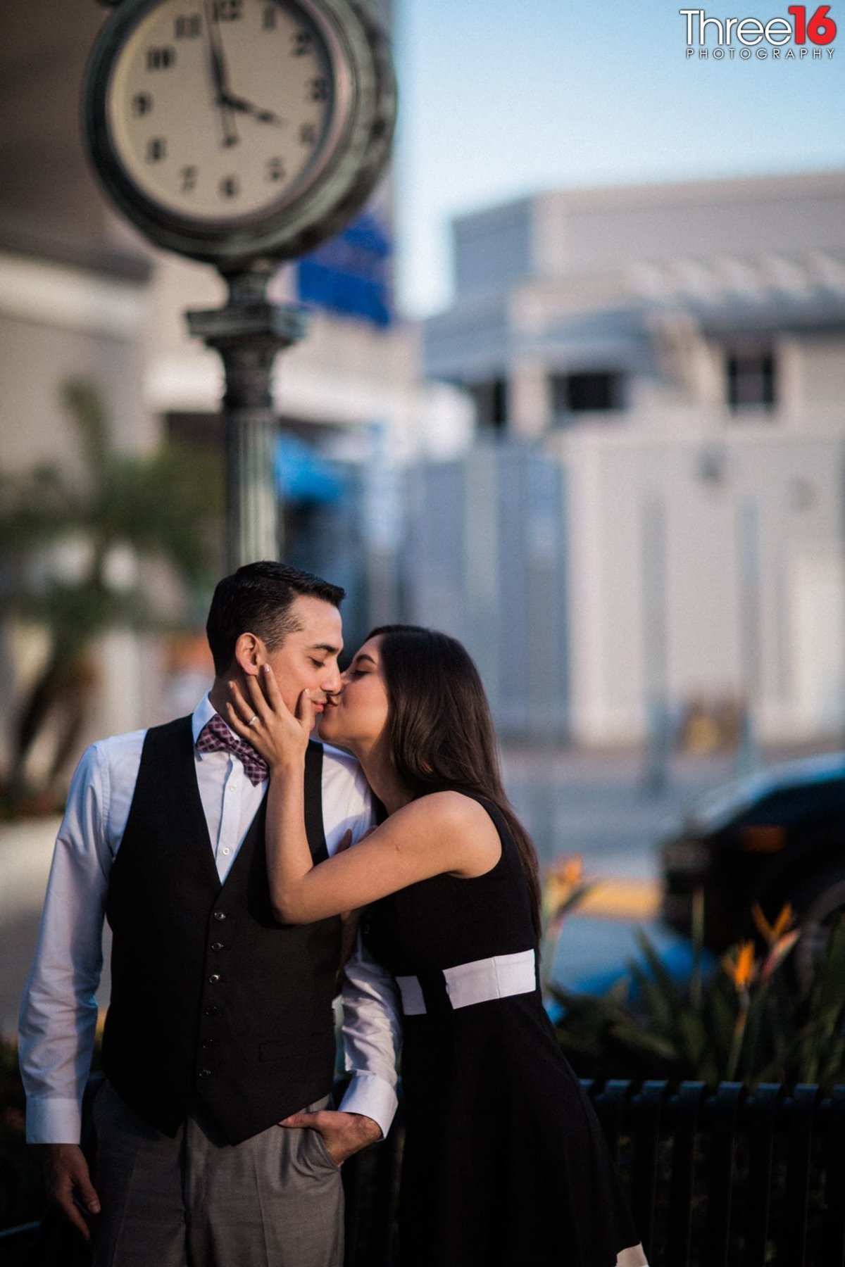 Engaged couple share a romantic kiss during their Newport Island engagement session