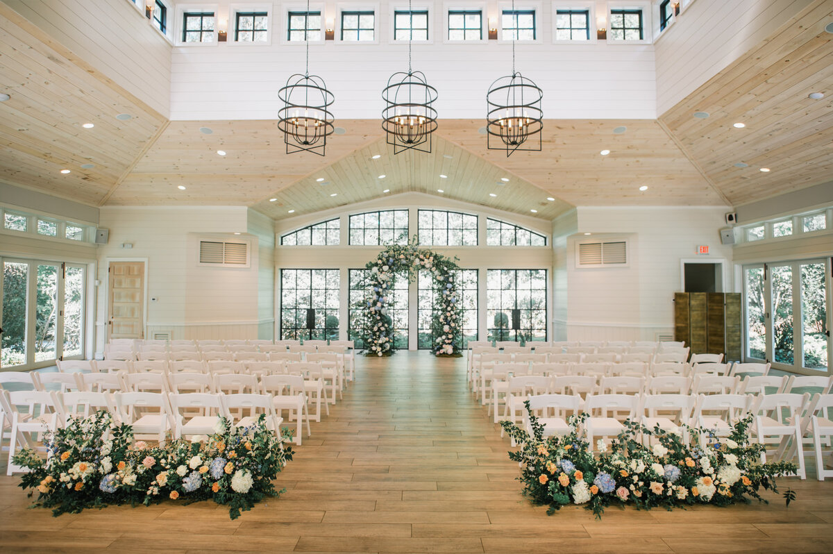 Luxurious floral ceremony arch with roses and hydrangeas at Old Edwards Inn wedding in Highlands, North Carolina.