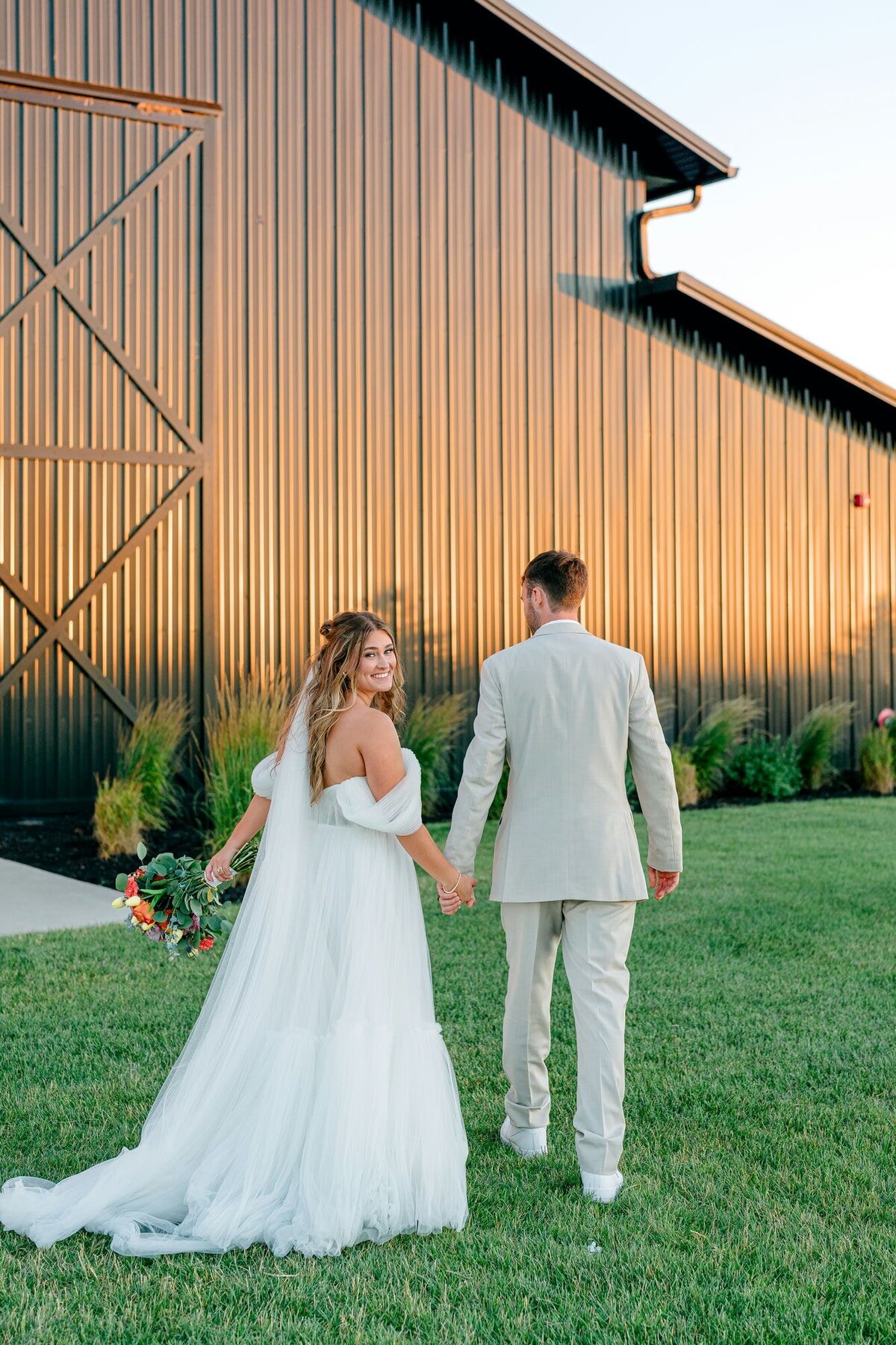 Couple-Holding-Hands-Back-View
