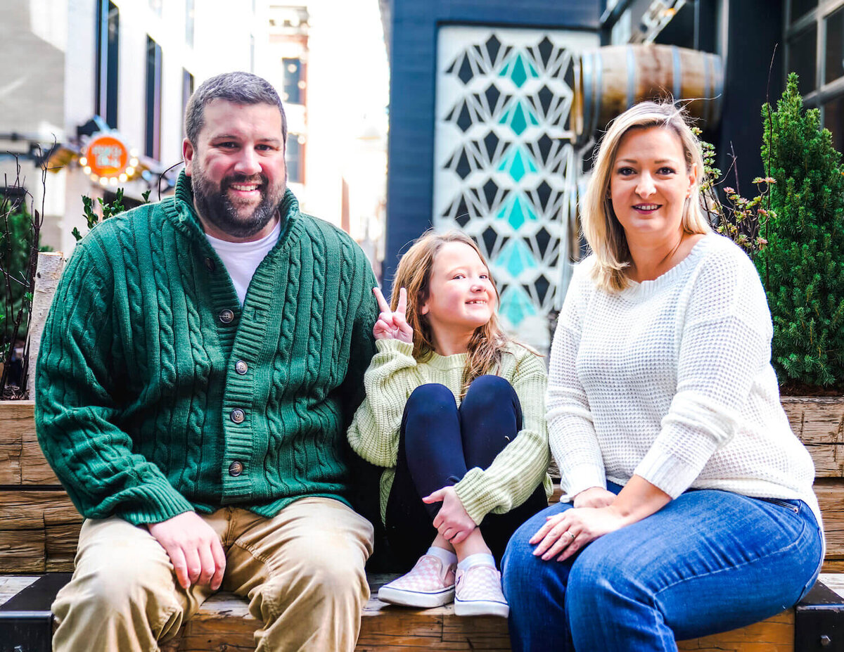 denver family photography - couple smiling with daughter